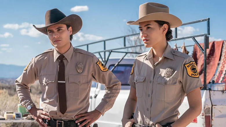 Kiowa Gordon as Jim Chee and Jessica Matten as Bernadette Manuelito wearing cowboy hats in Dark Winds