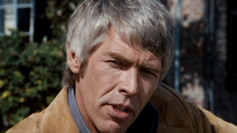 Dr. Peter Carey squinting and tilting his head in The Carey Treatment