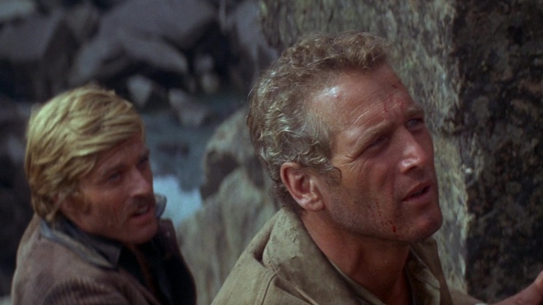 Paul Newman's Butch Cassidy and Robert Redford's Sundance Kid stand together behind some rocks in Butch Cassidy and the Sundance Kid.jpg