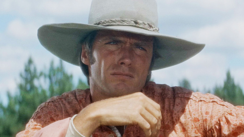 Clint Eastwood's Sylvester Newel looks off into the distance against a blue sky in Paint Your Wagon