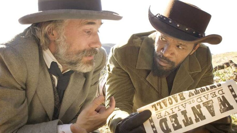 Christopher Waltz's Dr. King Schultz and Jamie Foxx's Django looking at a wanted poster in Django Unchained