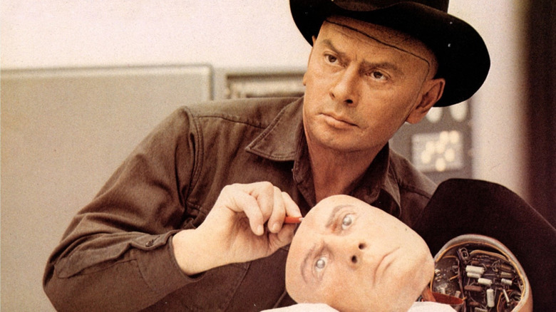 Yul Brynner as the Man in Black, holding a mask of his own face, in Westworld