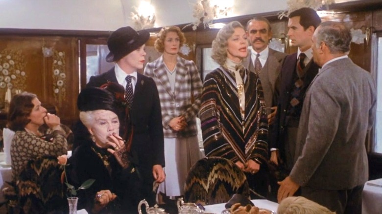 A group of suspects on a train car in Murder on the Orient Express