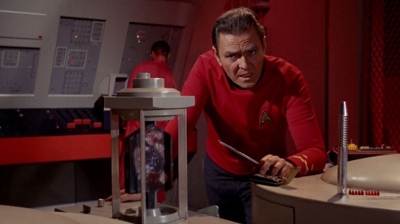 Scotty working on a dilithium crystal on Star Trek