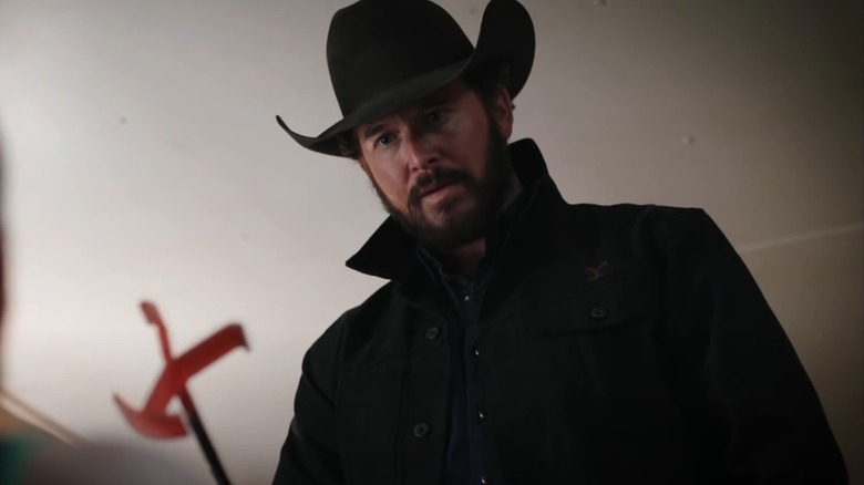 Rip holding a branding iron on "Yellowstone"