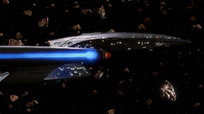 The Enterprise-D sailing through an asterid field on Star Trek: The Next Generation