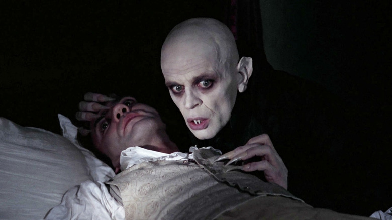 Count Dracula drinks Harker's blood in Nosferatu the Vampire