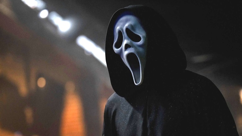 A close up of Ghostface in the auditorium in Scream 7