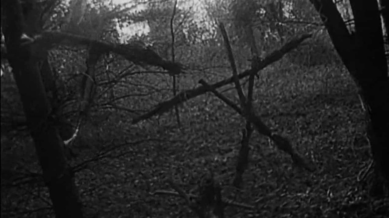 Iconic creepy stick figures in The Blair Witch Project