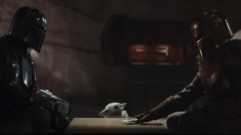 Pedro Pascal, Grogu, and Emily Swallow in The Mandalorian season 3, episode 1