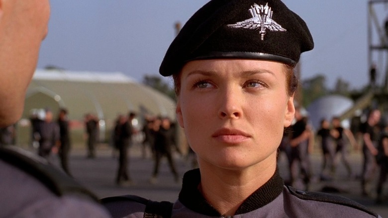 Dina Meyer as Dizzy Flores in Starship Troopers, in uniform at the barracks