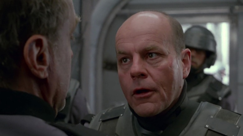 Michael Ironside as Jean Rasczak in Starship Troopers, arguing with someone