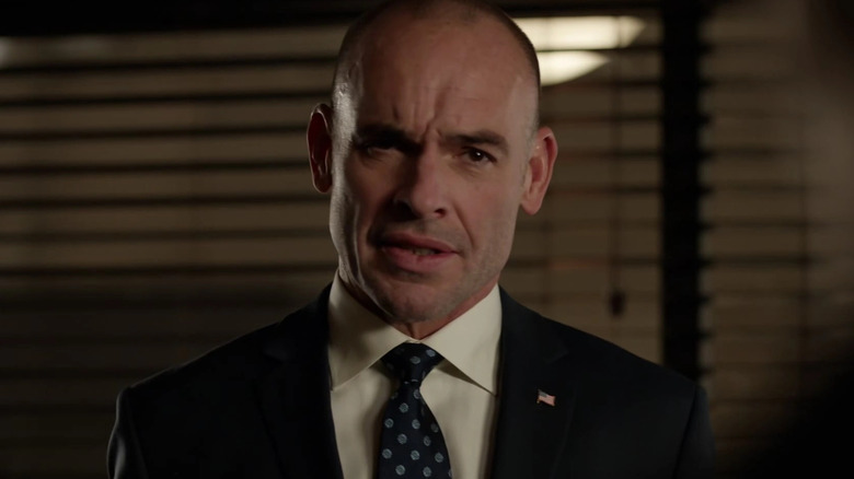 Paul Blackthorne as Quentin Lance, scowling on Arrow