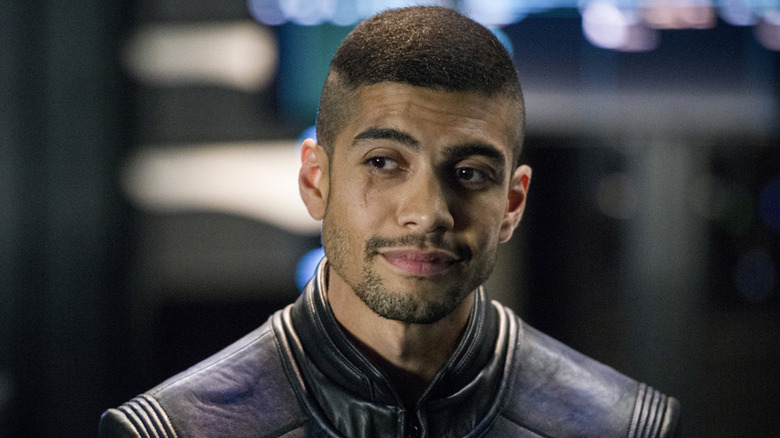 Rick Gonzales as Rene Ramirez, smiling in the cave on Arrow