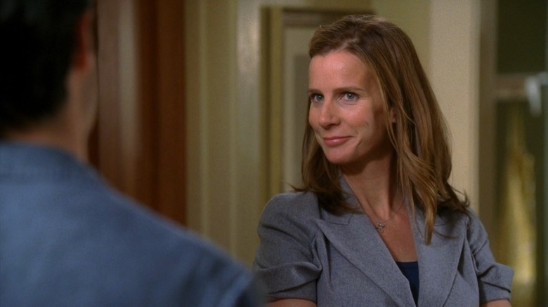 Rachel Griffiths as Sarah Walker on Brothers & Sisters, smirking in a grey suit