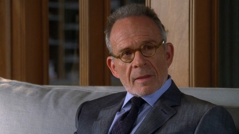 Ron Rifkin as Saul Holden on Brothers & Sisters, sitting on a couch