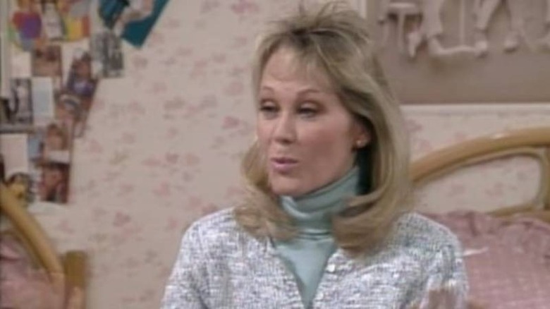 Ellen Powell (Sandra Kerns) talking on a bed on Charles in Charge
