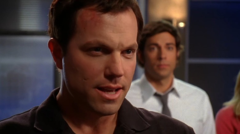 A closeup of Adam Baldwin as Casey on Chuck, with Chuck behind him
