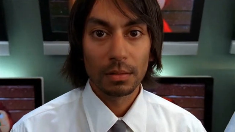 A closeup of Vik Sahay as Lester on Chuck, in his Buy More uniform