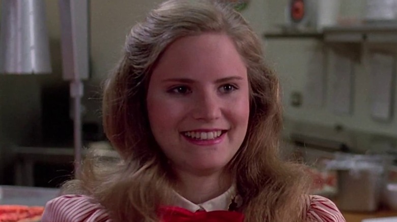 Jennifer Jason Leigh as Stacy Hamilton grinning in Fast Times at Ridgemont High