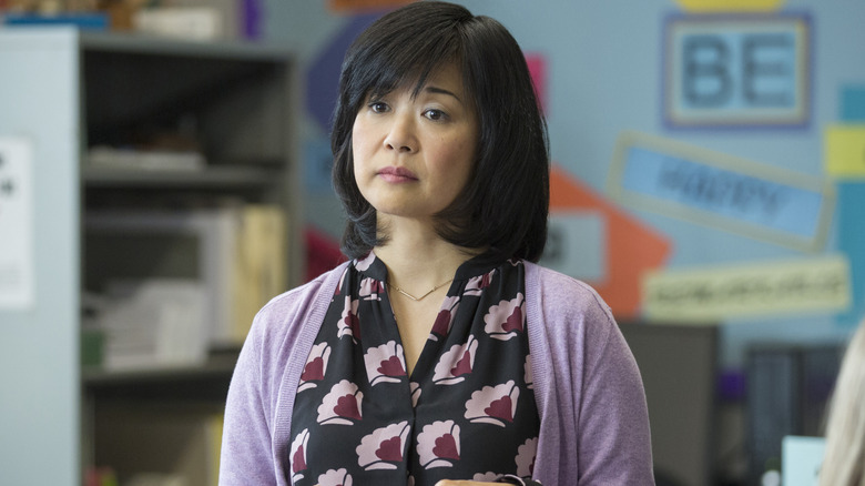 Keiko Agena as Mrs. Bradley, standing in her classroom on 13 Reasons Why