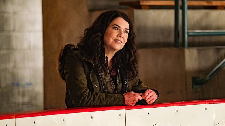 Lauren Graham as Alex Morrow on the side of an ice rink in Mighty Ducks: Game Changers