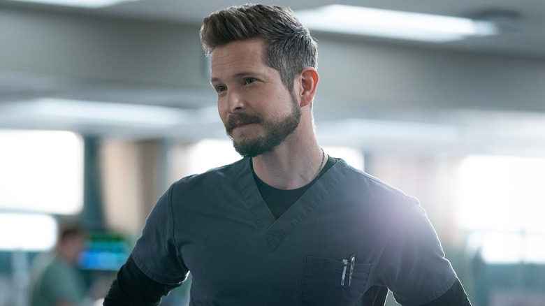 Matt Czuchry as Conrad Hawkins, standing in a hospital on The Resident