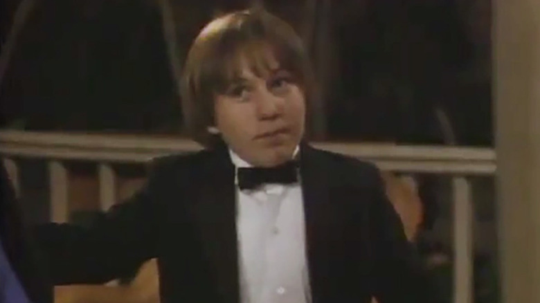 Stinky (Jamie Abbott) smirking in a tuxedo in Growing Pains