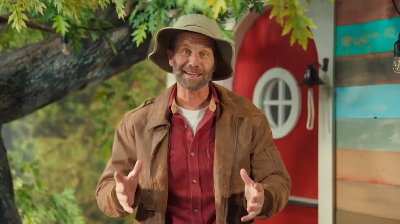 Kirk Cameron as Kirk wearing fishing gear in Iggy and Mr. Kirk