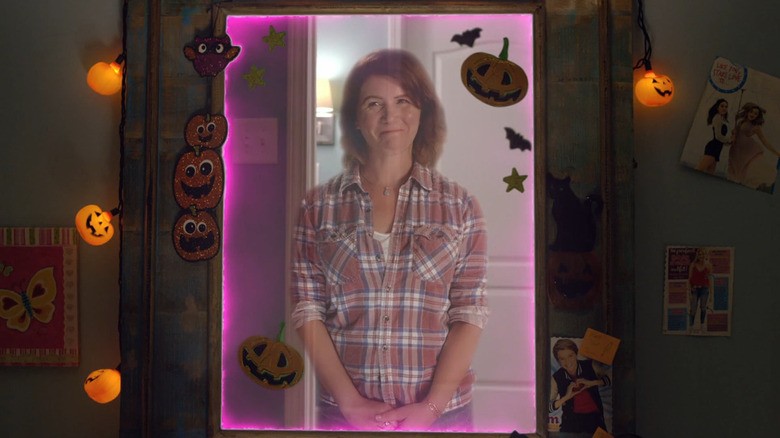 Didi Hallow (Tracey Gold) smiling proudly in mirror in All Hallow's Eve