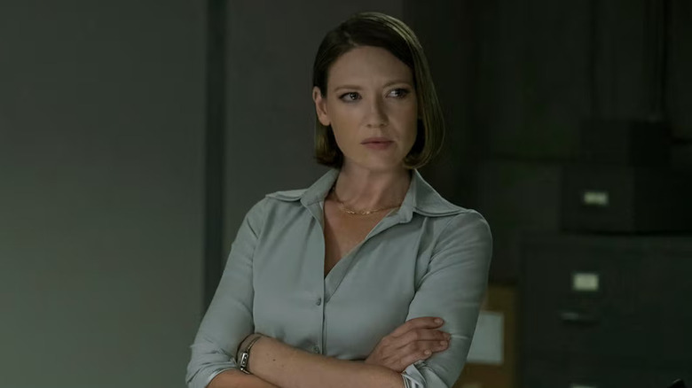 Wendy with her arms crossed looking at someone on Mindhunter