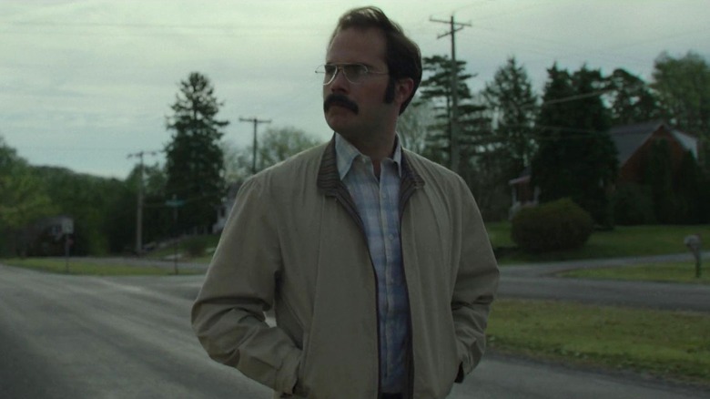 Dennis Rader walking down a street on Mindhunter