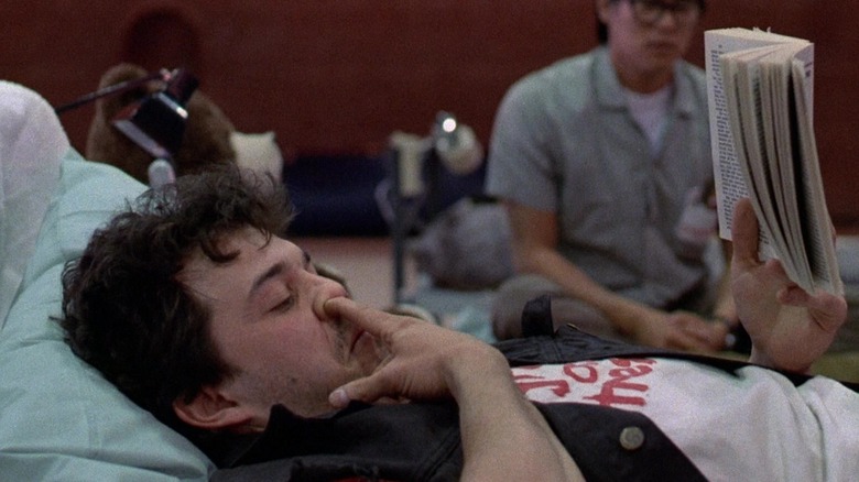 Curtis Armstrong as Booger demonstrates the origin of his nickname in Revenge of the Nerds