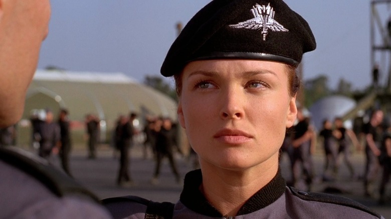Dina Meyer as Dizzy Flores in Starship Troopers, in uniform at the barracks