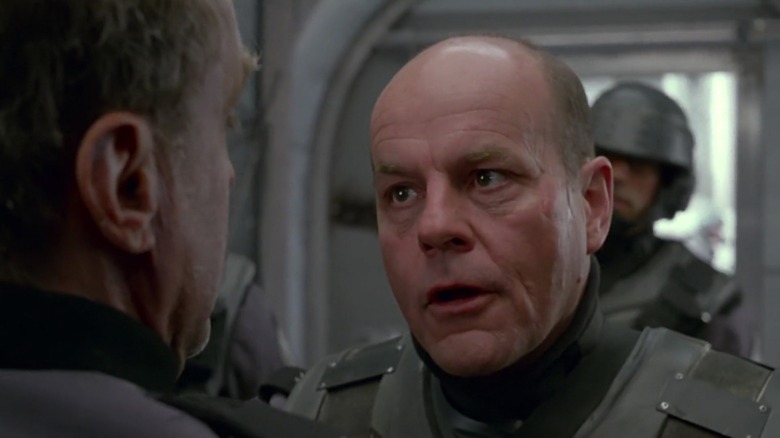 Michael Ironside as Jean Rasczak in Starship Troopers, arguing with someone