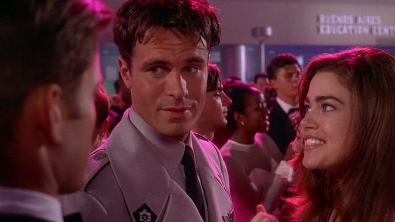 Patrick Muldoon as Zander Barcalow in Starship Troopers, at a dance with Denise Richards smiling at him