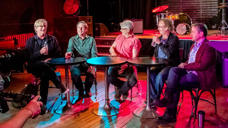 The Kids in the Hall sitting at tables being interviewed in Kids in the Hall: Comedy Punks