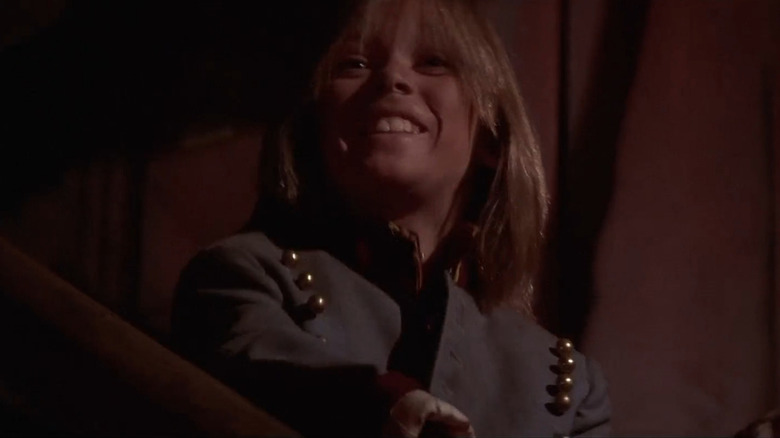 Laddie (Chance Michael Corbitt) grinning in The Lost Boys