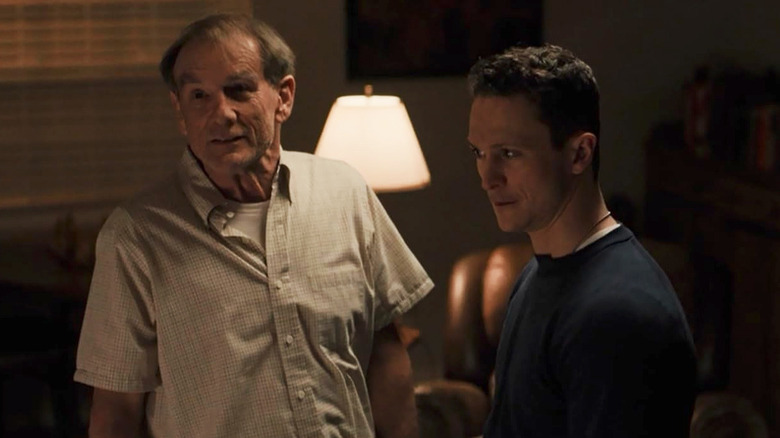 John Henry Diehl as Colonel McDonald in a living room with Jonathan Tucker as Matt McDonald in Snowfall
