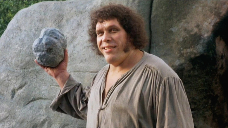 Andre the Giant as Fezzik holding a rock in The Princess Bride