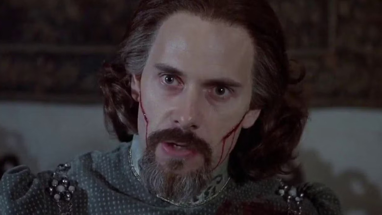 Christopher Guest as Count Rugen with cuts on his cheeks in The Princess Bride