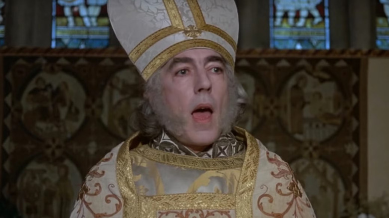 Peter Cook as the clergyman presiding in church in The Princess Bride