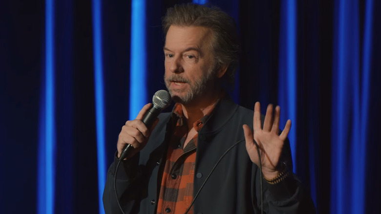 David Spade performing stand up comedy on stage