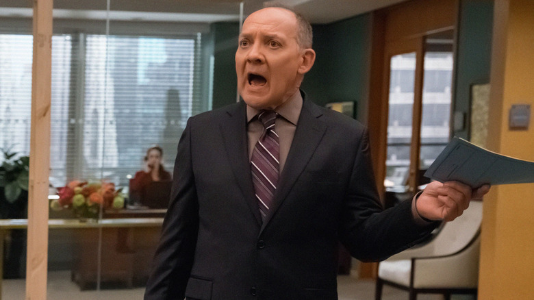 Zach Grenier as David Lee, waving a pamphlet screaming on The Good Wife