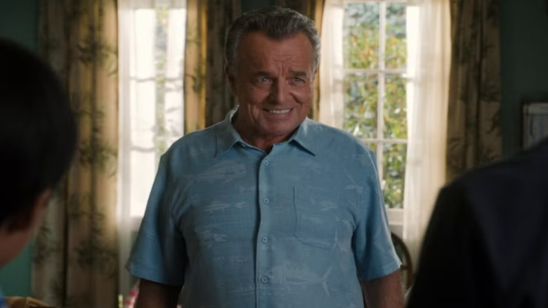 Ray Wise as Marvin Ellis smiling in a living room in Fresh Off the Boar