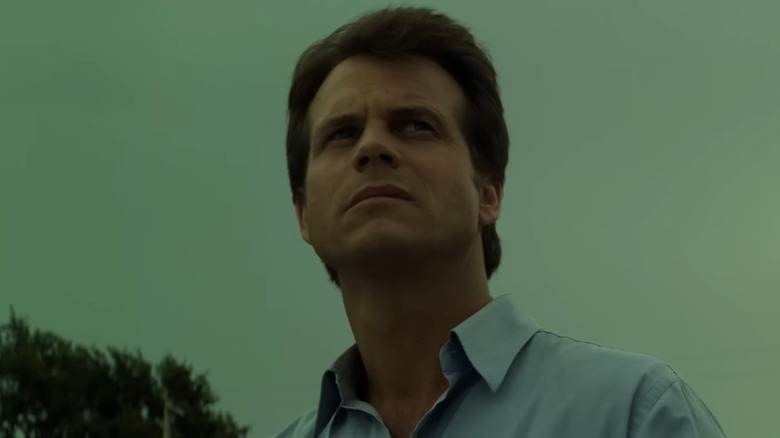 Bill Paxton as Bill in Twister, against a foreboding sky