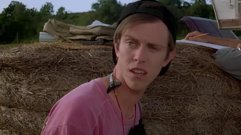 Sean Whalen as Allan in Twister, standing in front of a hay bale