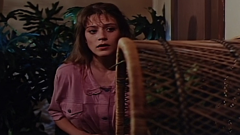 Farrah Forke as Laurie, caught in the act as she discovers the deadly secret of Brain Twisters.