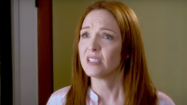 Amy Yasbeck as Meg seeks advice from her husband in Little Women Big Cars.