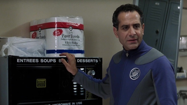 Tony Shalhoub as Fred Kwan is underwhelmed by catering in Galaxy Quest.